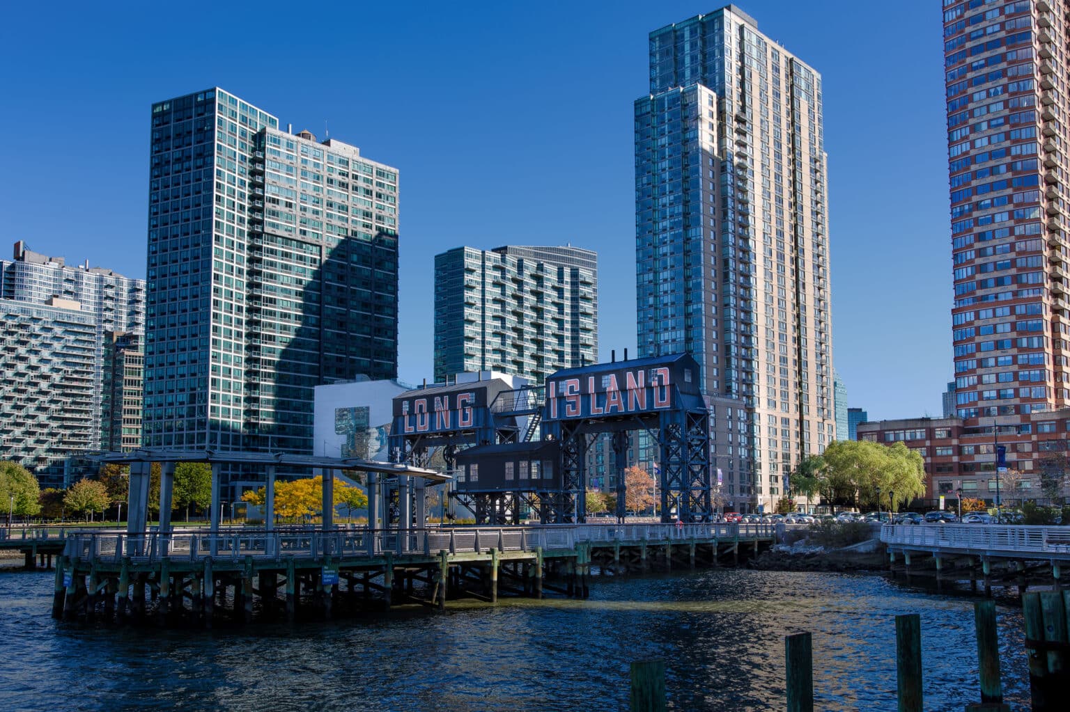 Pier at Gantry Plaza State Park and Residential High-rises of Long Island City in the Morning, Queens, New York.