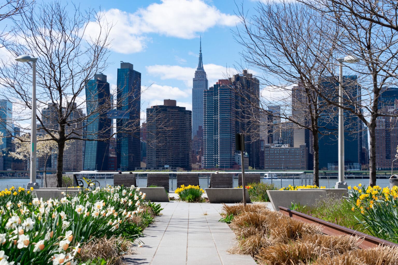 Empty Walkway at Gantry Plaza State Park in Long Island City Queens New York with a view of the Midtown Manhattan Skyline during Spring