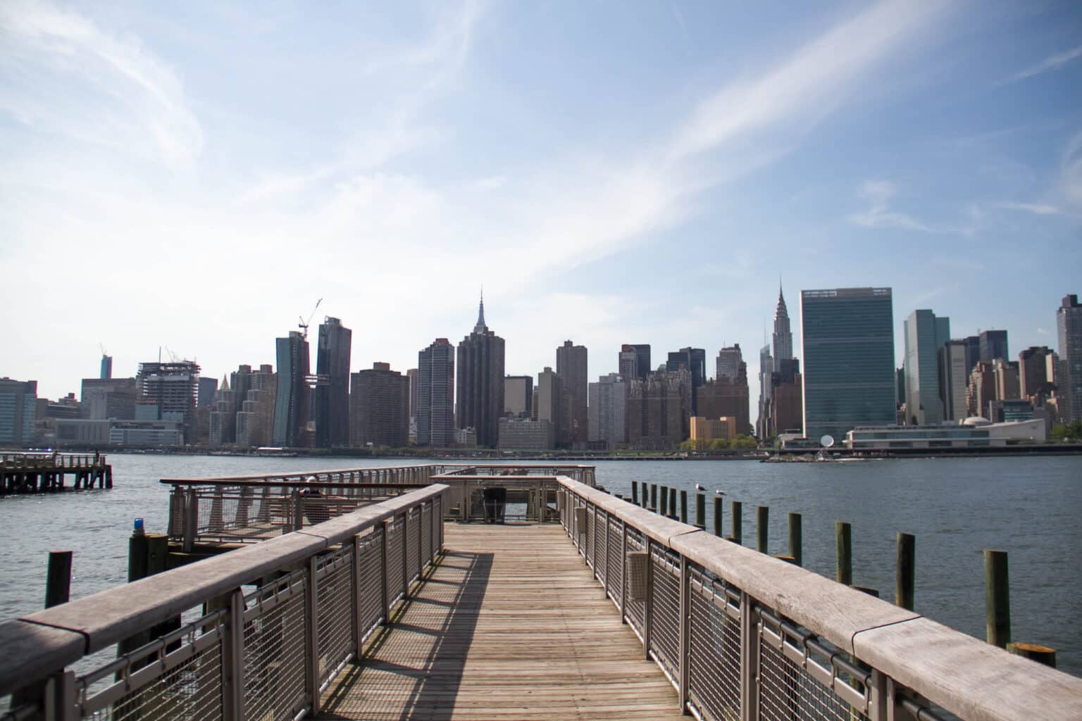 Pier at Gantry Plaza State Park and Manhattan city, New York