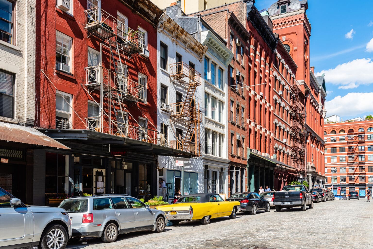 Street scene in Tribeca with classic yellow Cadillac Eldorado, New York