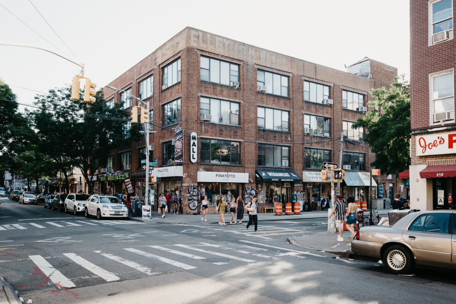 Williamsburg, Brooklyn, United States - June 23 , 2019: People are walking along Bedford Avenue in Williamsburg, Brooklyn on a beautiful weekend afternoon.